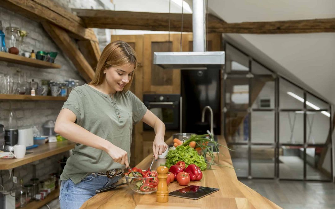 happy-young-woman-cooking-delicious-and-healthy-food